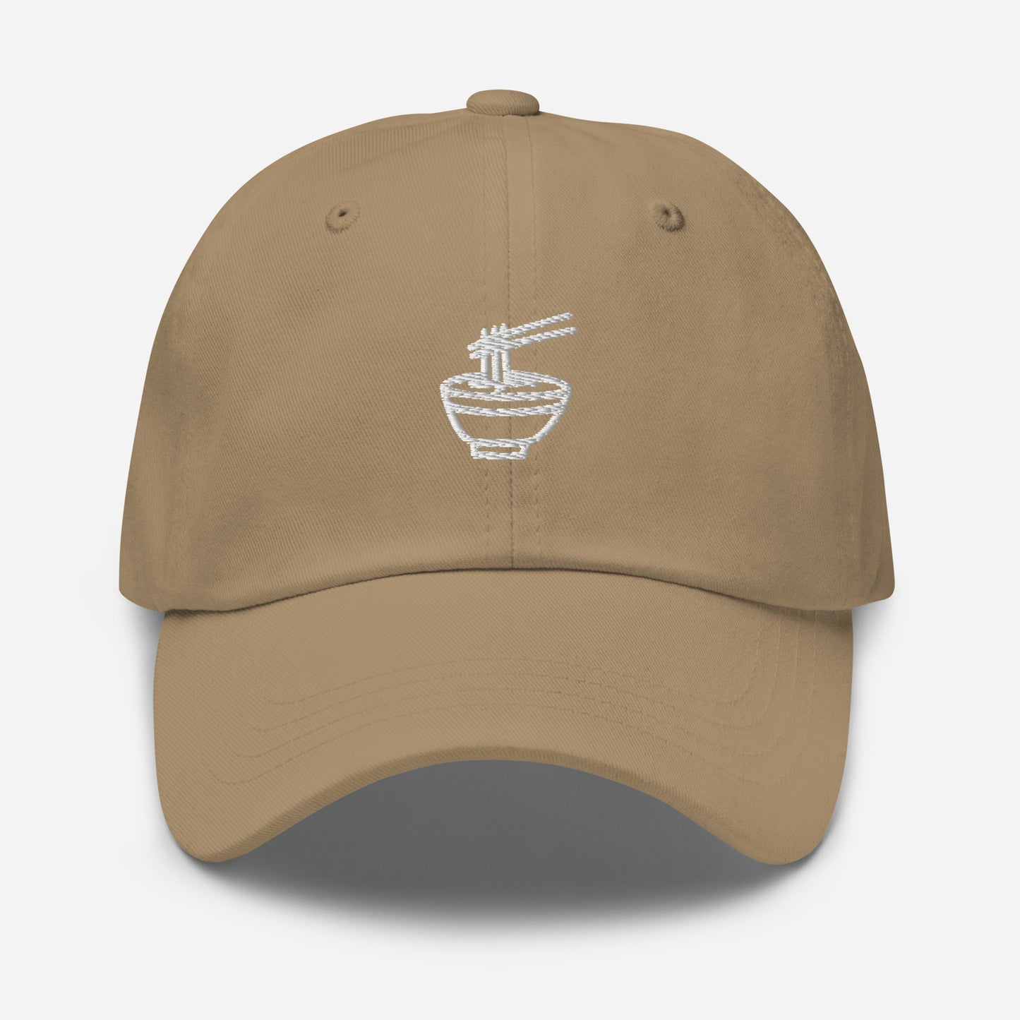 Khaki dad hat with white emblem stitching of a noodle bowl with chopsticks picking up noodles in the middle of the front of the hat. Front View