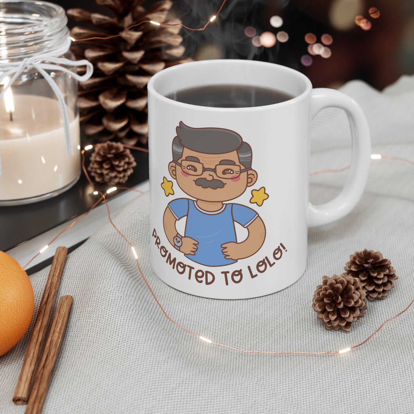 White mug with a kawaii picture of an old man with a mustache wearing glasses. A caption below the picture reads Promoted to Lolo! Front view