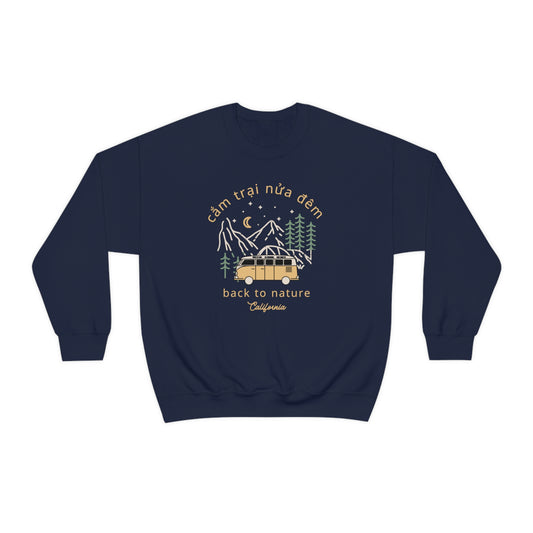 Crewneck sweatshirt with a picture of a camping van in the woods at night. Words on top of design reads Cam Trai Nua Dem. Bottom words read Back to Nature. Below Back to Nature caption reads California. Front view.