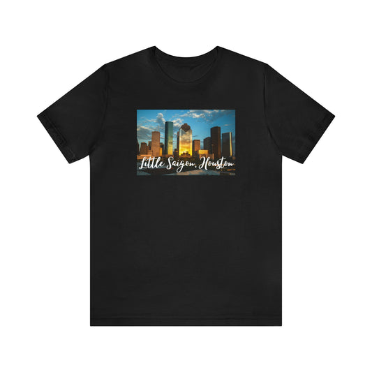 Black t-shirt with square picture of city of Houston, TX with the words Little Saigon, Houston in white letters at the bottom of the picture. Front view