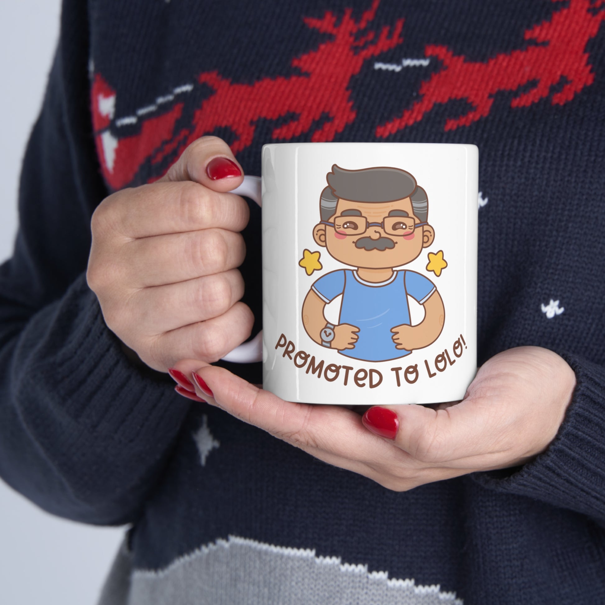 White mug with a kawaii picture of an old man with a mustache wearing glasses. A caption below the picture reads Promoted to Lolo! Front view