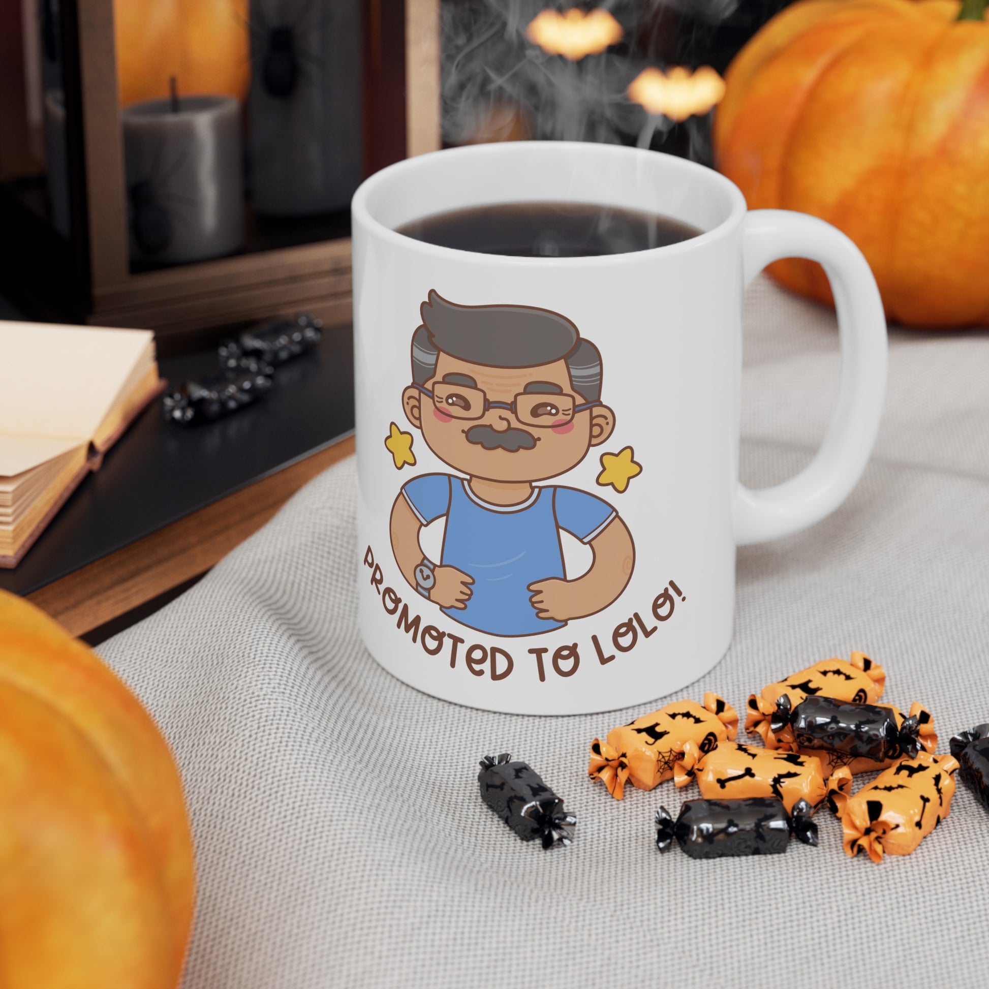 White mug with a kawaii picture of an old man with a mustache wearing glasses. A caption below the picture reads Promoted to Lolo! Front view