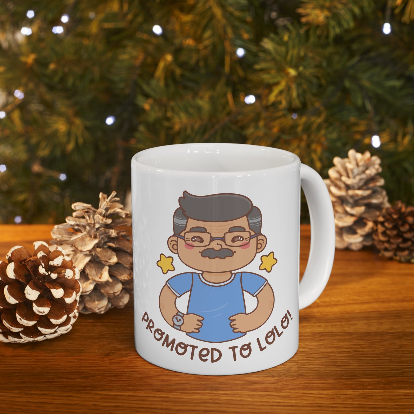 White mug with a kawaii picture of an old man with a mustache wearing glasses. A caption below the picture reads Promoted to Lolo! Front view