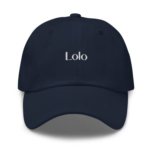 Navy blue dad hat with the word Lolo in white stitching in the middle of the front of the hat. Front view